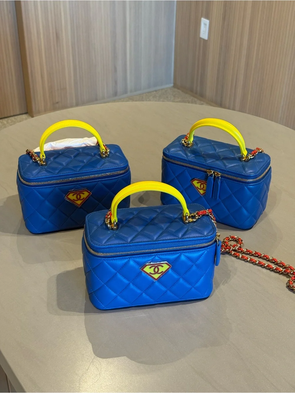 CHANEL Blue Quilted Crossbody Vanity Bag with Yellow Handle hero/superman